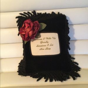 Accent pillow with script and rose.